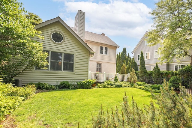 674 Foxdale Ave, Winnetka, IL 60093 - rear view of property featuring a chimney