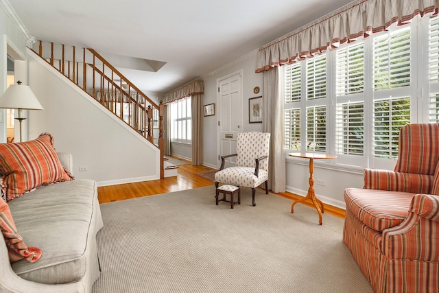 674 Foxdale Ave, Winnetka, IL 60093 - living area featuring stairway, wood finished floors, and ornamental molding