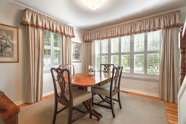 674 Foxdale Ave, Winnetka, IL 60093 - dining space featuring healthy amount of natural light, crown molding, and light wood-type flooring