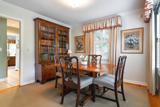 674 Foxdale Ave, Winnetka, IL 60093 - dining room featuring healthy amount of natural light and crown molding