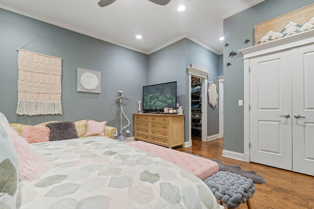 663 W Wellington Ave Unit 1, Chicago, IL 60657 - bedroom featuring crown molding, wood finished floors, a closet, baseboards, and recessed lighting