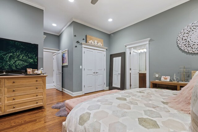 663 W Wellington Ave Unit 1, Chicago, IL 60657 - bedroom with wood finished floors, crown molding, baseboards, recessed lighting, and a closet