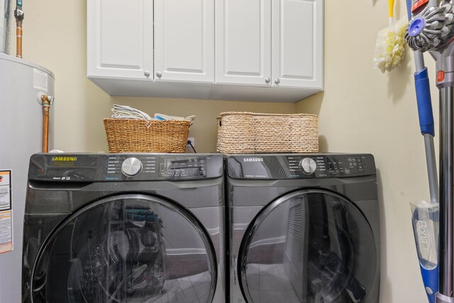 663 W Wellington Ave Unit 1, Chicago, IL 60657 - washroom with cabinet space, independent washer and dryer, and water heater