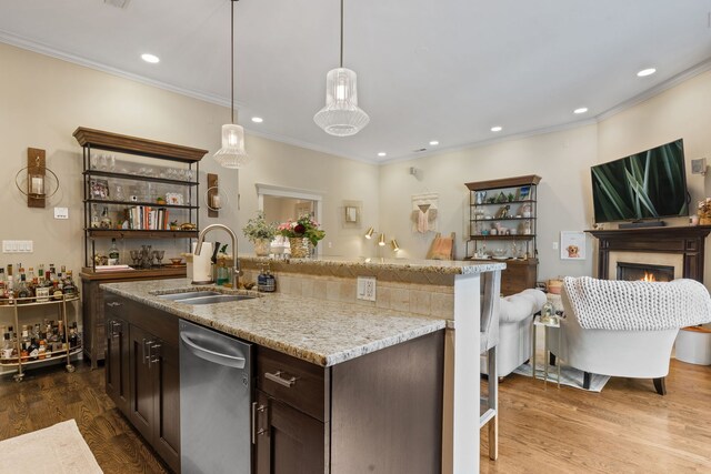 663 W Wellington Ave Unit 1, Chicago, IL 60657 - kitchen with a sink, stainless steel dishwasher, crown molding, dark brown cabinetry, and dark wood-style flooring