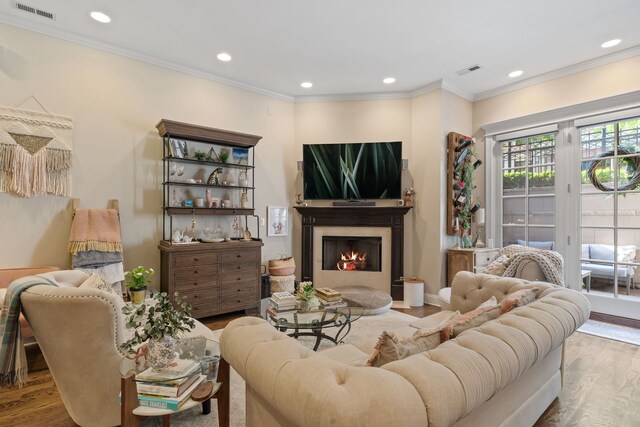 663 W Wellington Ave Unit 1, Chicago, IL 60657 - living area featuring wood finished floors, recessed lighting, a lit fireplace, and ornamental molding