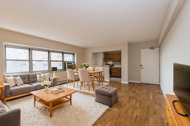 4960 N Marine Dr Unit 720, Chicago, IL 60640 - living room with light wood finished floors and a baseboard radiator
