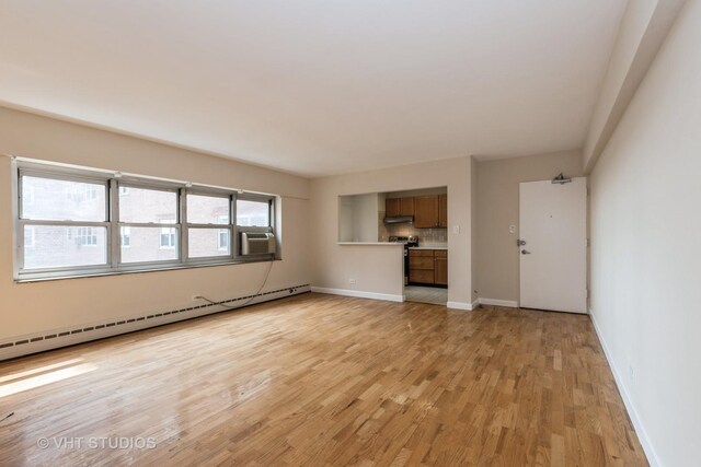 4960 N Marine Dr Unit 720, Chicago, IL 60640 - unfurnished living room with baseboard heating, light wood-style floors, and cooling unit