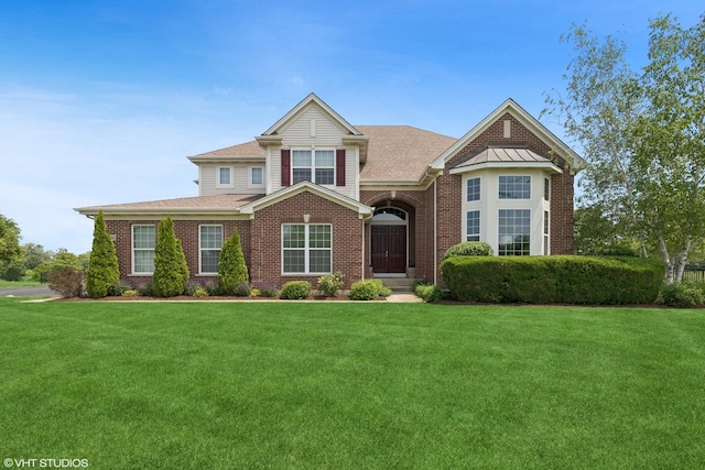 2621 Hastings Ct, Gurnee, IL 60031 - view of front of house featuring a front yard, brick siding, and a shingled roof