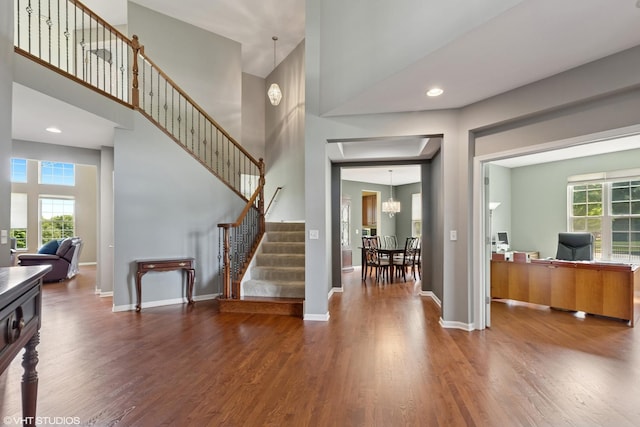 2621 Hastings Ct, Gurnee, IL 60031 - foyer entrance with a towering ceiling, wood finished floors, baseboards, stairway, and a chandelier