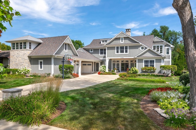 1308 N Wright St, Naperville, IL 60563 - view of front of home featuring a chimney, driveway, an attached garage, board and batten siding, and a front lawn