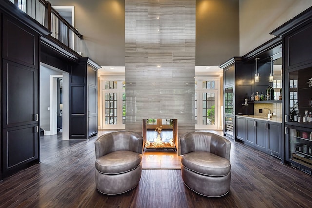 1308 N Wright St, Naperville, IL 60563 - sitting room featuring a towering ceiling, wet bar, recessed lighting, and dark wood-type flooring
