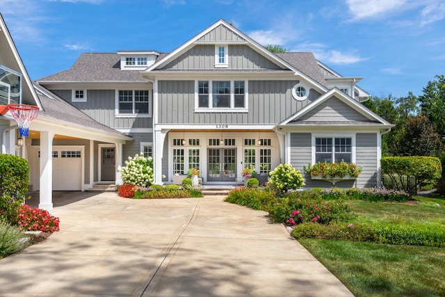 1308 N Wright St, Naperville, IL 60563 - view of front of home featuring french doors, driveway, an attached garage, a shingled roof, and board and batten siding