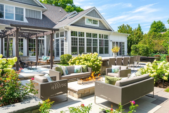 1308 N Wright St, Naperville, IL 60563 - rear view of property with an outdoor living space with a fire pit, a pergola, a shingled roof, a patio, and board and batten siding