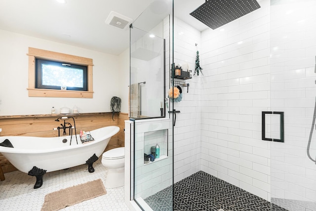 3N544 Bittersweet Rd, Saint Charles, IL 60175 - bathroom with a shower stall, a freestanding bath, toilet, a wainscoted wall, and tile patterned flooring