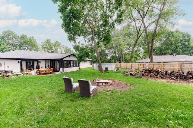 3N544 Bittersweet Rd, Saint Charles, IL 60175 - view of yard featuring an outdoor fire pit, a sunroom, and a patio
