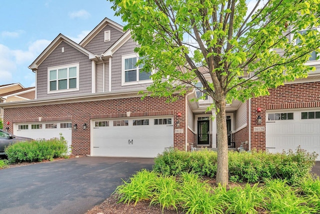 16127 W Switch Grass Rd, Lockport, IL 60441 - view of front facade featuring asphalt driveway, brick siding, and a garage