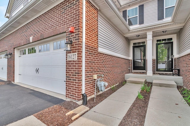 16127 W Switch Grass Rd, Lockport, IL 60441 - doorway to property with brick siding and asphalt driveway