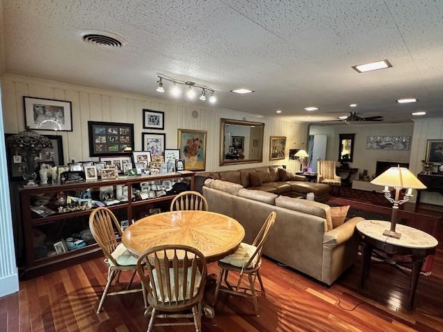 22 Greencroft Dr, Champaign, IL 61821 - dining space featuring wood finished floors, a ceiling fan, and a textured ceiling