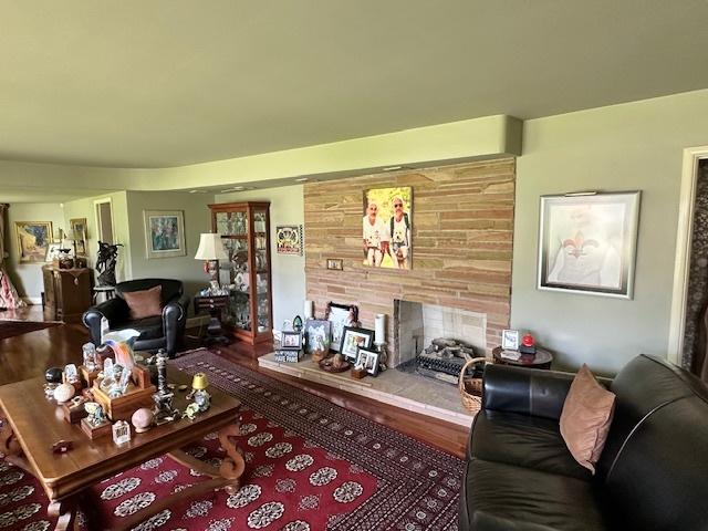 22 Greencroft Dr, Champaign, IL 61821 - living room featuring a tile fireplace and wood finished floors