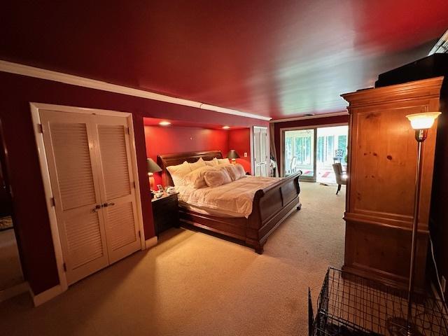 22 Greencroft Dr, Champaign, IL 61821 - bedroom with light carpet, access to outside, and ornamental molding