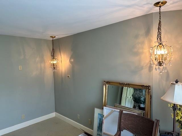 22 Greencroft Dr, Champaign, IL 61821 - unfurnished dining area with a chandelier, baseboards, and concrete flooring