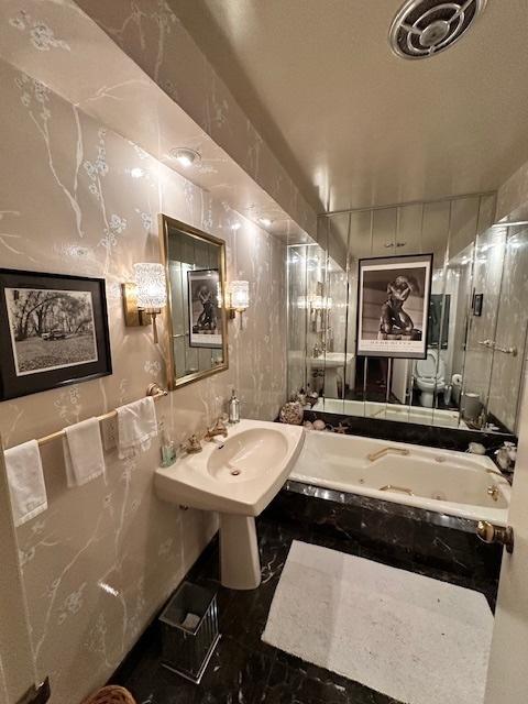 22 Greencroft Dr, Champaign, IL 61821 - bathroom with a tub with jets and toilet