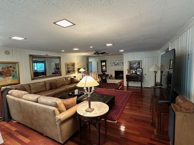 22 Greencroft Dr, Champaign, IL 61821 - living area featuring wood finished floors, a ceiling fan, and a textured ceiling