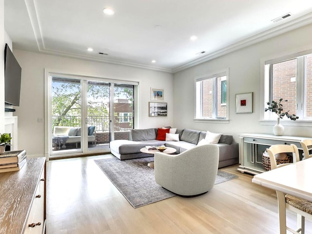 2745 N Greenview Ave Unit 2, Chicago, IL 60614 - living room with light wood-style floors, ornamental molding, and recessed lighting