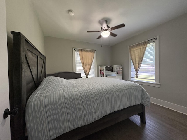 903 E Behrends Ave, Peoria, IL 61603 - bedroom with multiple windows, wood finished floors, baseboards, and a ceiling fan