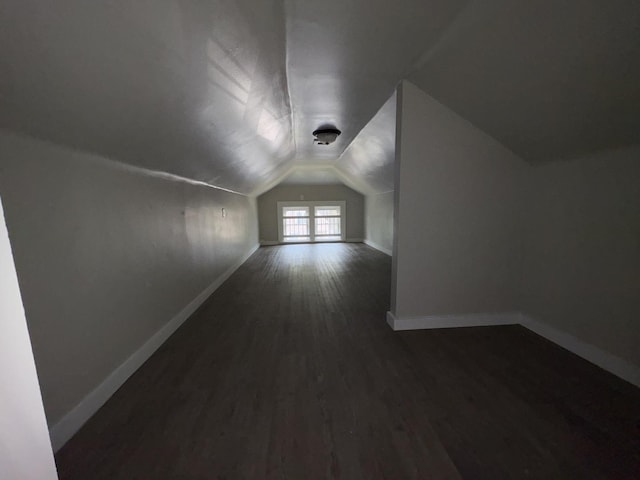 903 E Behrends Ave, Peoria, IL 61603 - bonus room with baseboards, dark wood-type flooring, and lofted ceiling