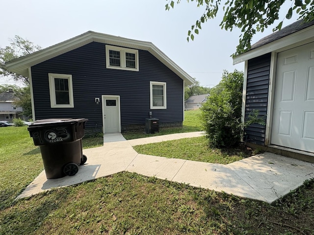 903 E Behrends Ave, Peoria, IL 61603 - rear view of property featuring a lawn and central AC unit