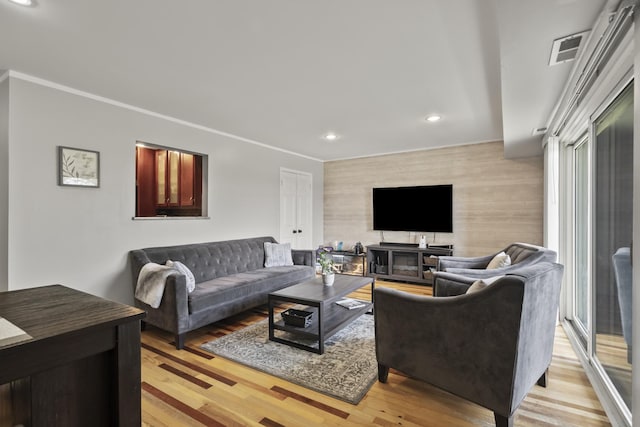 990 Perrie Dr Unit 201, Elk Grove Village, IL 60007 - living room with an accent wall, recessed lighting, light wood-type flooring, and crown molding