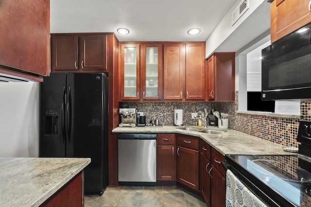 990 Perrie Dr Unit 201, Elk Grove Village, IL 60007 - kitchen with black appliances, a sink, light stone countertops, tasteful backsplash, and glass insert cabinets