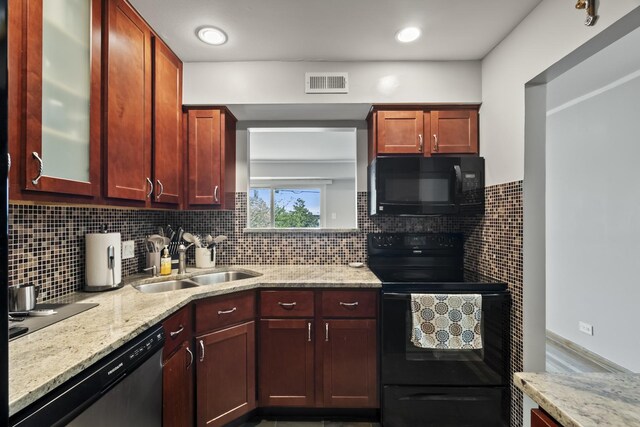 990 Perrie Dr Unit 201, Elk Grove Village, IL 60007 - kitchen with black appliances, a sink, dark brown cabinets, and light stone countertops
