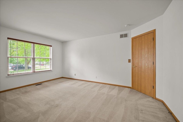 249 Spring Ct, North Aurora, IL 60542 - unfurnished room with light colored carpet and baseboards