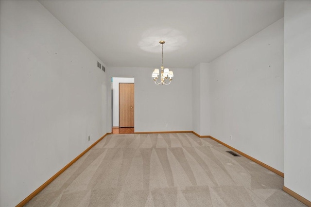 249 Spring Ct, North Aurora, IL 60542 - carpeted spare room featuring a chandelier and baseboards