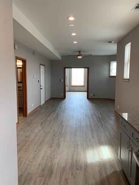 3116 S Canal St, Chicago, IL 60616 - unfurnished living room with a ceiling fan, light wood-style flooring, baseboards, and recessed lighting