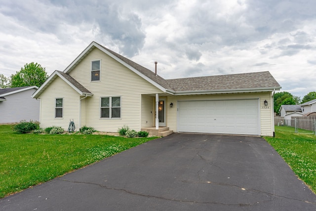 5724 Pierce Ln, South Beloit, IL 61080 - traditional-style home featuring asphalt driveway, a garage, and a shingled roof