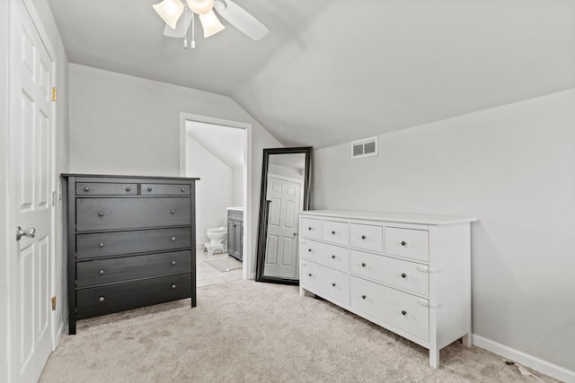 5724 Pierce Ln, South Beloit, IL 61080 - bedroom with vaulted ceiling, light carpet, ensuite bathroom, ceiling fan, and baseboards