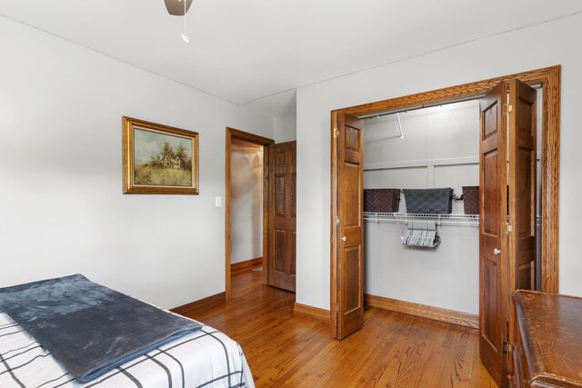 11111 Doogan Ave, Willow Springs, IL 60480 - bedroom with wood finished floors, a closet, baseboards, and a ceiling fan