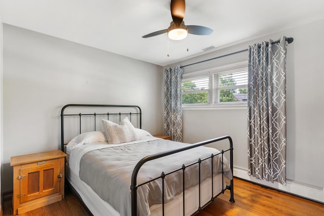 11111 Doogan Ave, Willow Springs, IL 60480 - bedroom featuring a baseboard radiator, wood finished floors, and ceiling fan