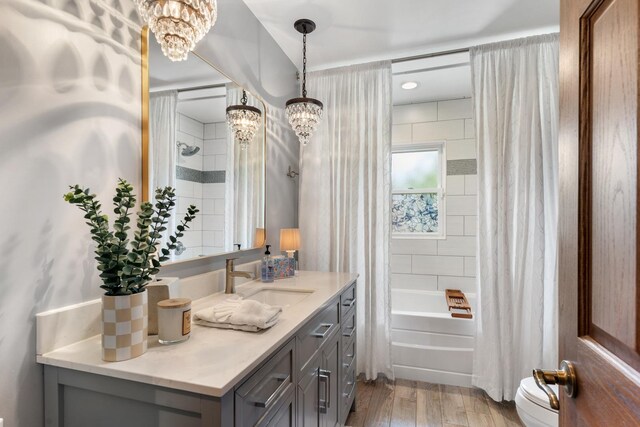 11111 Doogan Ave, Willow Springs, IL 60480 - full bath featuring vanity, a chandelier, shower / tub combo with curtain, wood finished floors, and toilet