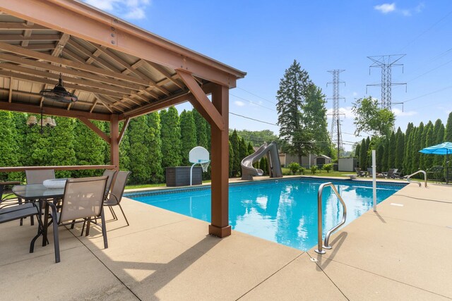 11111 Doogan Ave, Willow Springs, IL 60480 - outdoor pool with a water slide, a gazebo, a patio, and outdoor dining space