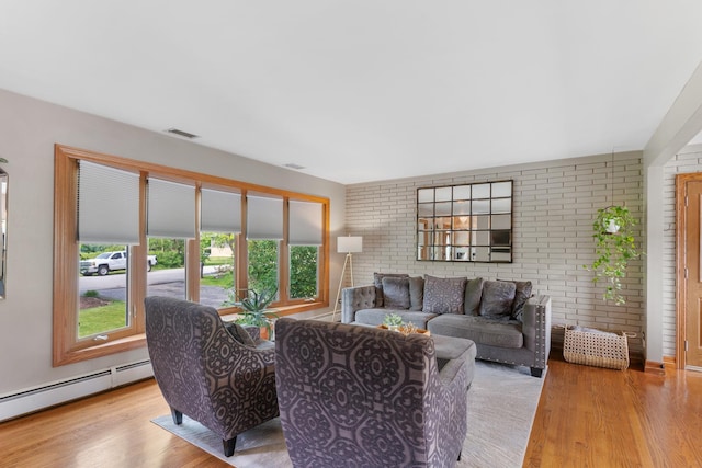 11111 Doogan Ave, Willow Springs, IL 60480 - living room with baseboard heating, wood finished floors, and brick wall