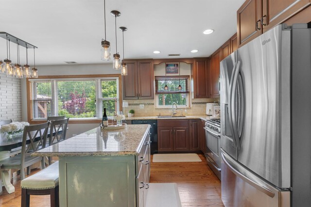 11111 Doogan Ave, Willow Springs, IL 60480 - kitchen featuring stainless steel appliances, healthy amount of natural light, light wood-style flooring, a sink, and recessed lighting