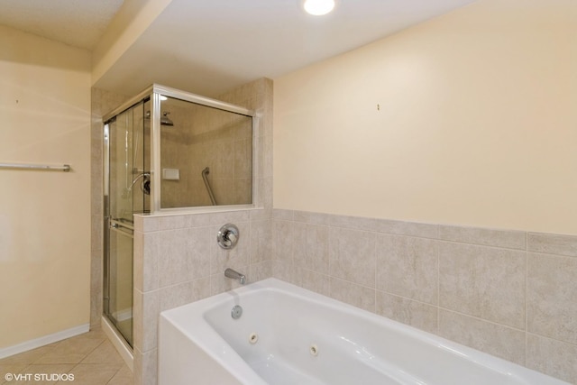 6807 N Milwaukee Ave Unit 303, Niles, IL 60714 - bathroom with a jetted tub, a stall shower, and tile patterned floors