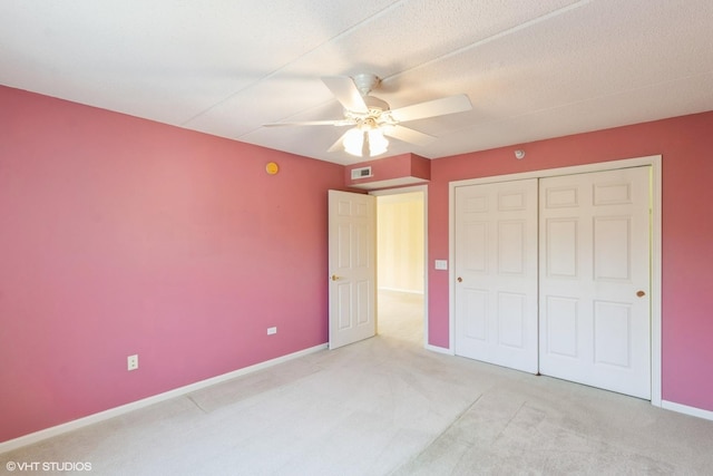 6807 N Milwaukee Ave Unit 303, Niles, IL 60714 - unfurnished bedroom featuring carpet floors, a closet, and a ceiling fan
