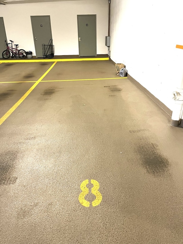 6807 N Milwaukee Ave Unit 303, Niles, IL 60714 - garage with baseboards