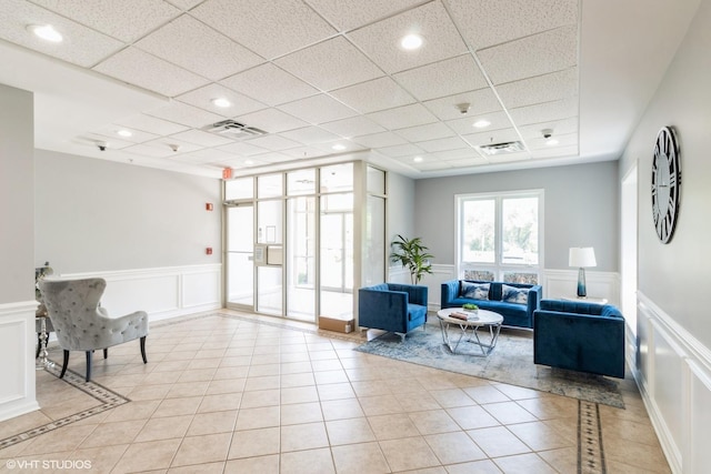 6807 N Milwaukee Ave Unit 303, Niles, IL 60714 - common area featuring a decorative wall, a paneled ceiling, wainscoting, recessed lighting, and a surveillance system
