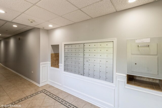 6807 N Milwaukee Ave Unit 303, Niles, IL 60714 - view of community with mail area, recessed lighting, a drop ceiling, and a wainscoted wall